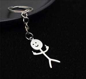 metal keychain giving the middle finger 